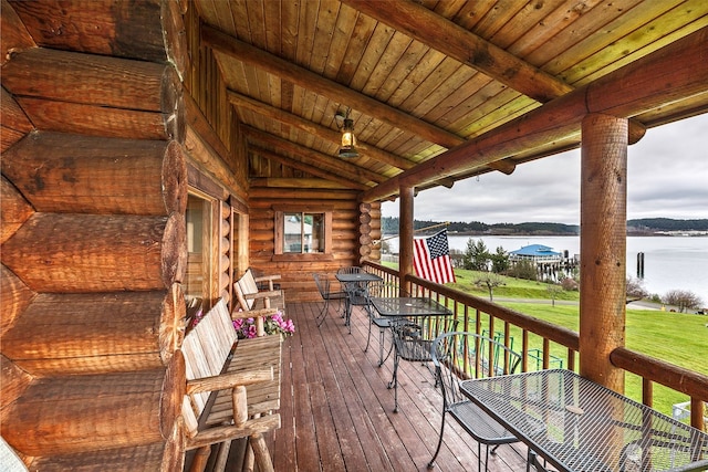 wooden deck featuring a water view