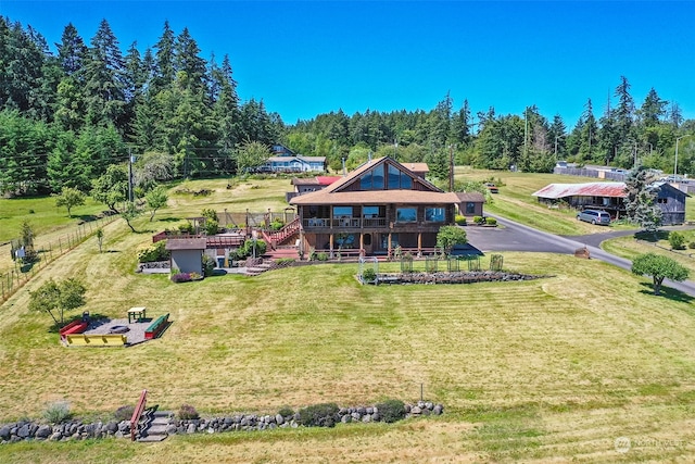 back of property featuring a deck