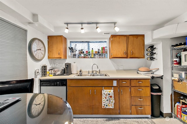 kitchen with track lighting, dishwasher, and sink