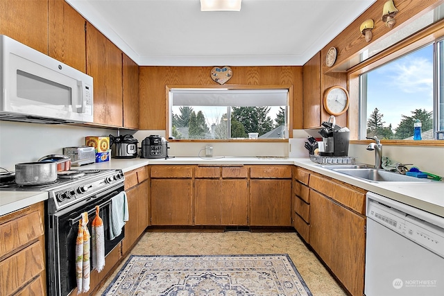 kitchen featuring white appliances and sink