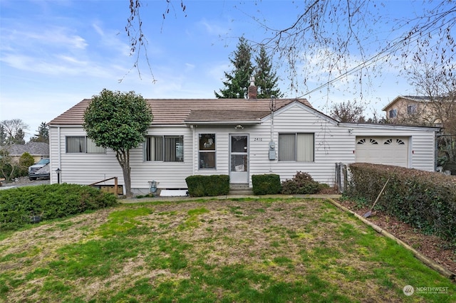 ranch-style house with a front lawn and a garage