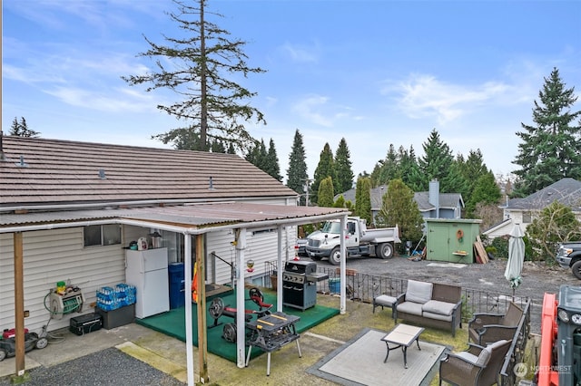 exterior space featuring an outdoor hangout area and grilling area