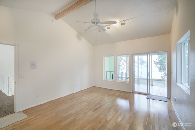 empty room featuring ceiling fan, high vaulted ceiling, light hardwood / wood-style floors, and beam ceiling