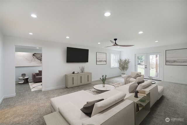 living room with ceiling fan, light carpet, and french doors