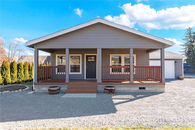 view of front of home with covered porch and a garage