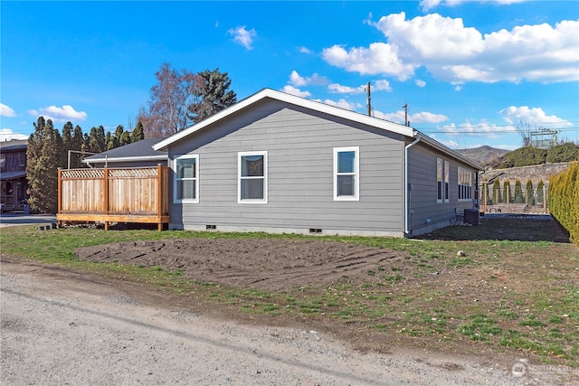 view of home's exterior with a deck