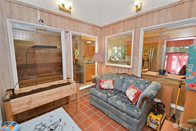 tiled living room with wood walls