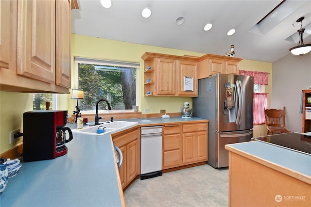 kitchen featuring stainless steel fridge, light tile floors, light brown cabinets, sink, and white dishwasher