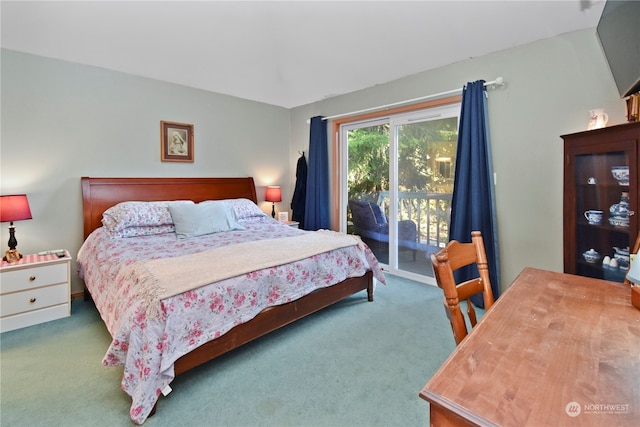 bedroom featuring dark carpet and access to outside