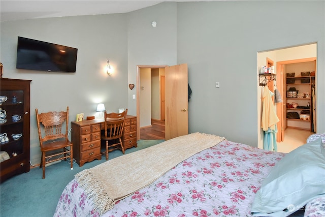 bedroom with light carpet and high vaulted ceiling