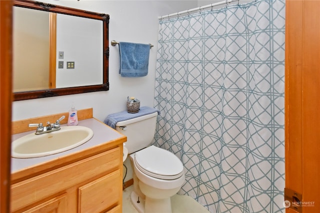 bathroom with toilet and vanity