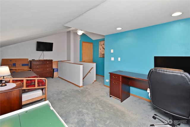 carpeted office space with lofted ceiling