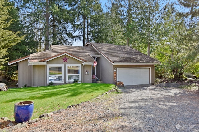 single story home with a front yard and a garage