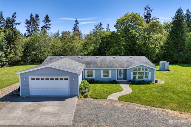 ranch-style home featuring a front lawn and a garage