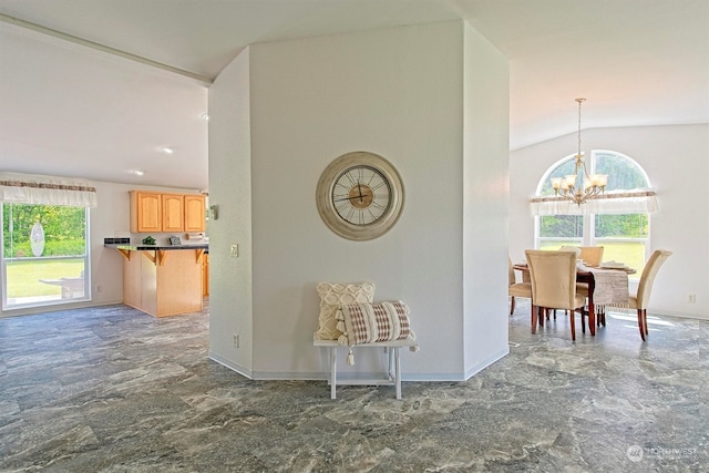 hall with tile flooring, an inviting chandelier, and vaulted ceiling