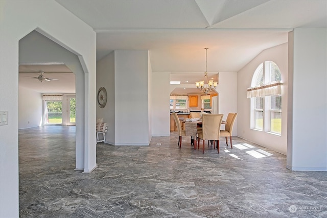 tiled dining area featuring ceiling fan with notable chandelier