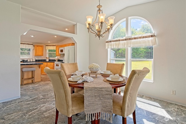 dining room featuring a notable chandelier, tile floors, and lofted ceiling