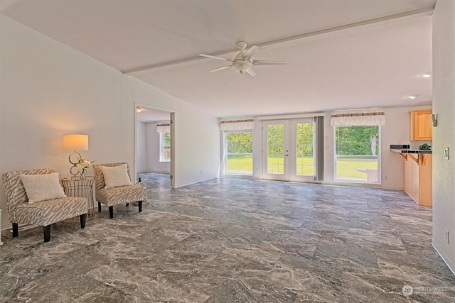 sitting room with tile floors, ceiling fan, and french doors