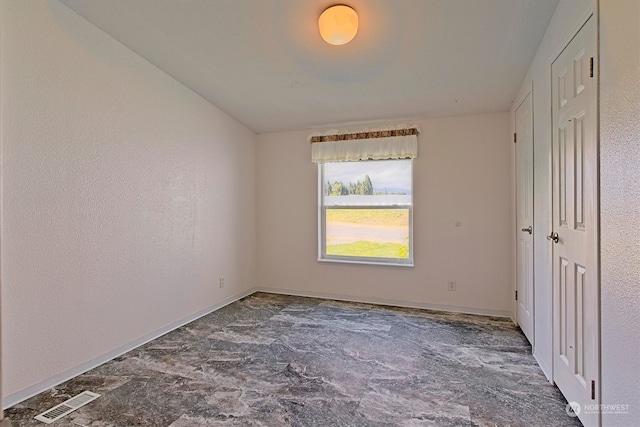 unfurnished bedroom with tile floors