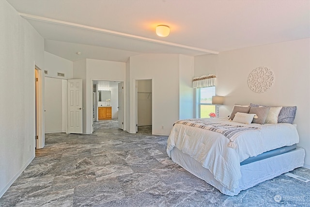 tiled bedroom with a spacious closet and a closet