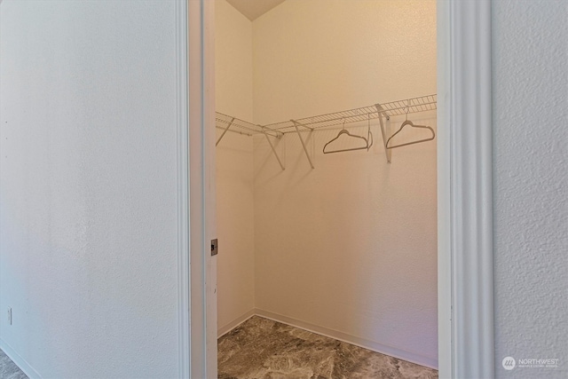 spacious closet with tile floors