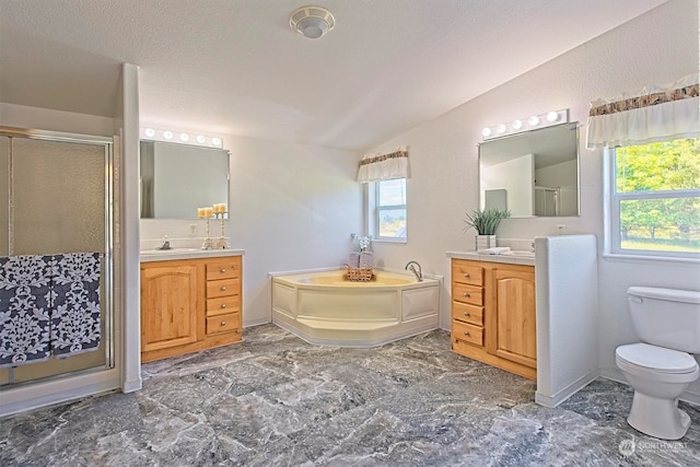 bathroom featuring tile flooring, a wealth of natural light, and vanity