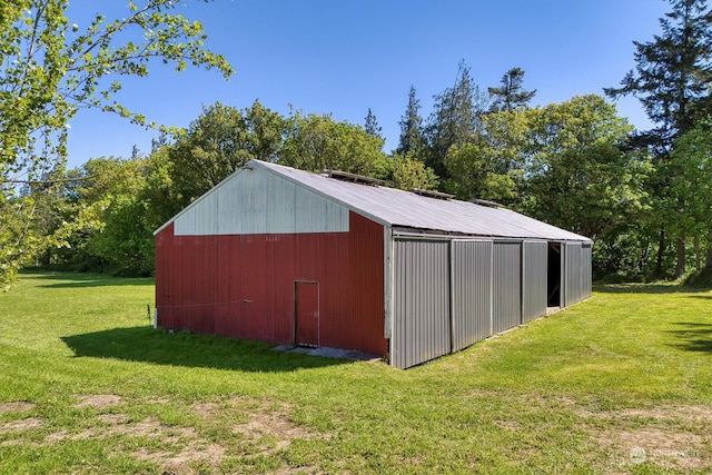 view of shed / structure featuring a lawn