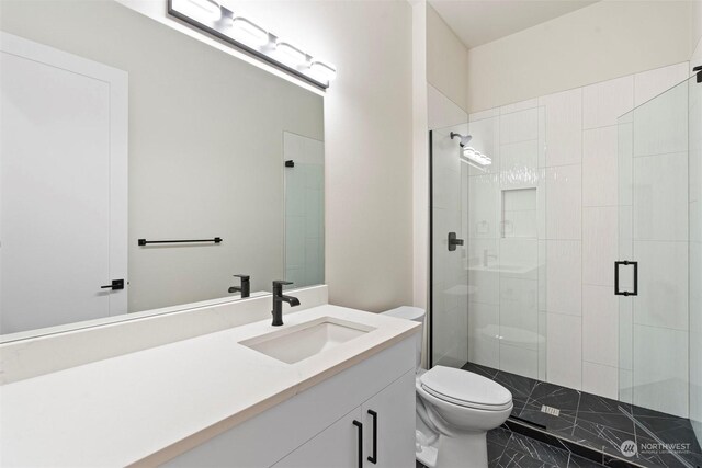 bathroom featuring vanity, toilet, tile patterned flooring, and an enclosed shower