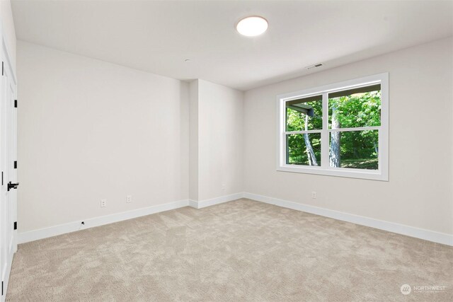 unfurnished room featuring carpet floors