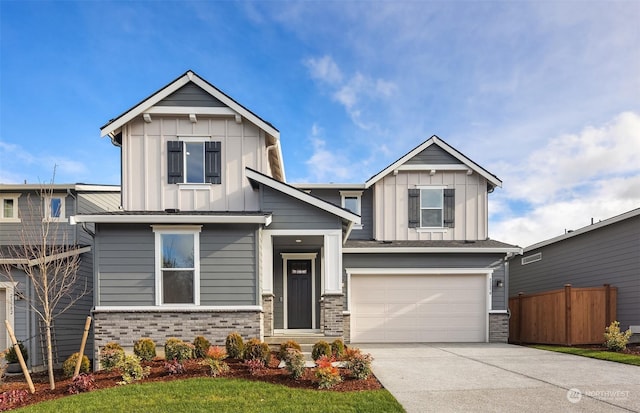 craftsman-style home featuring a garage and a front lawn