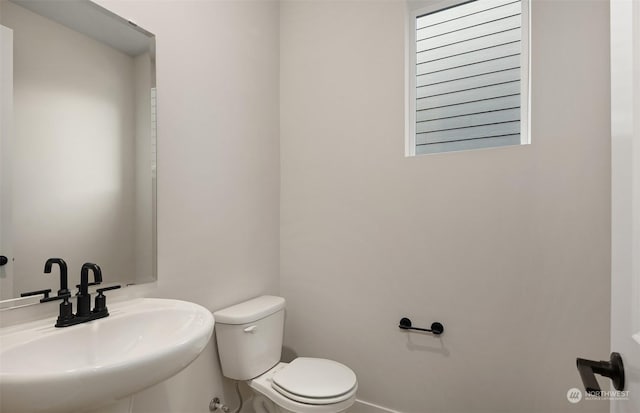 bathroom featuring sink and toilet