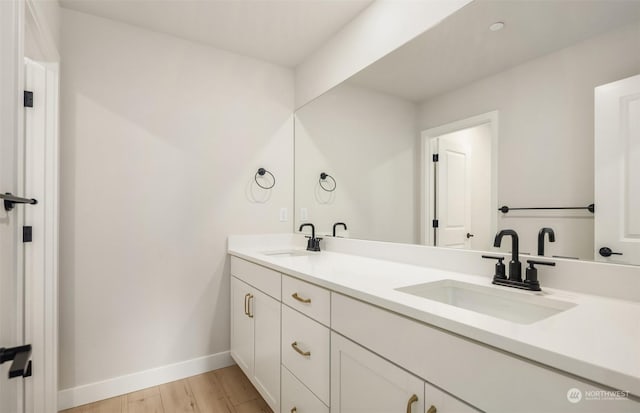 bathroom featuring vanity and hardwood / wood-style floors