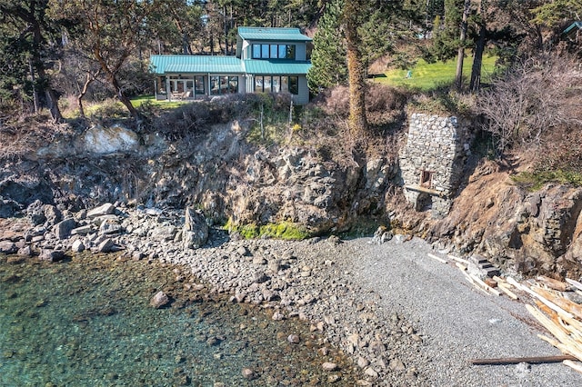 birds eye view of property featuring a water view