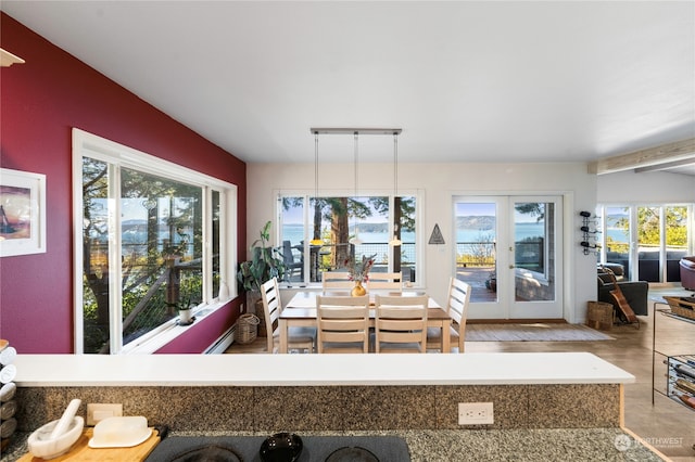 kitchen featuring decorative light fixtures and beamed ceiling