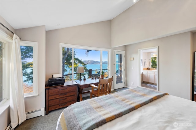 carpeted bedroom with connected bathroom, lofted ceiling, multiple windows, and a water view