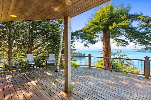 wooden deck featuring a water view