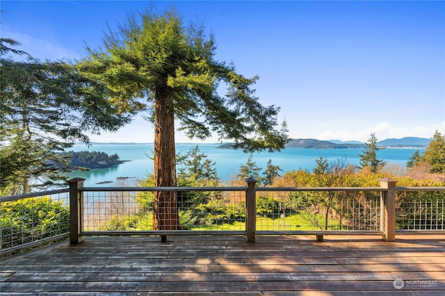 deck featuring a water and mountain view