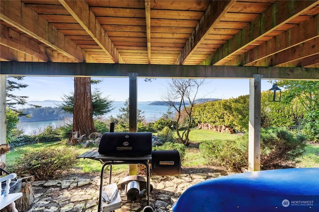 view of patio / terrace with a water view