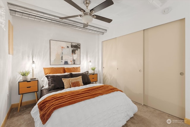 carpeted bedroom with ceiling fan