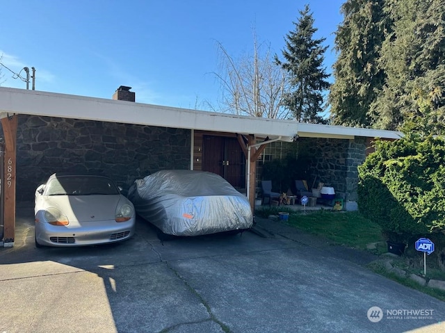 view of front of home with a carport