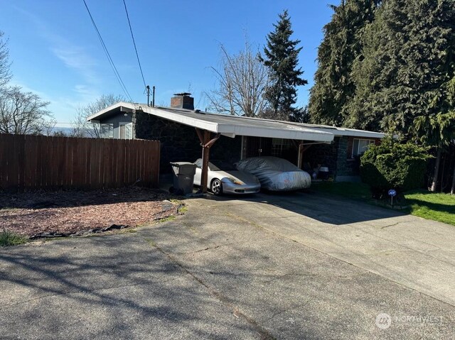 view of home's exterior with a carport