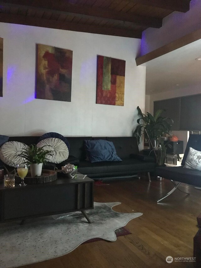 living room featuring wood ceiling, dark hardwood / wood-style floors, and lofted ceiling with beams