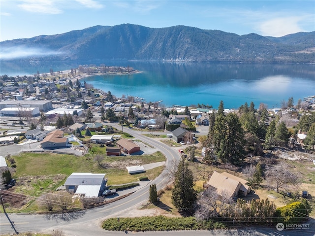 bird's eye view with a water and mountain view