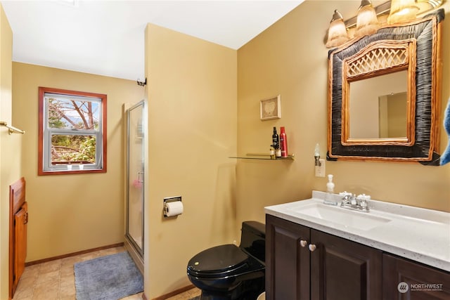 bathroom featuring tile flooring, vanity, toilet, and a shower with door