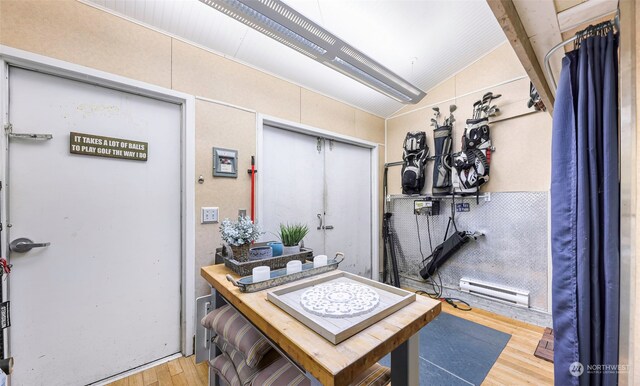 interior space featuring lofted ceiling with beams and light wood-type flooring