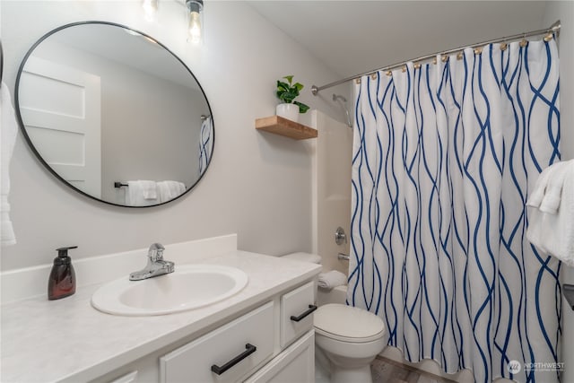 full bathroom featuring toilet, shower / tub combo, vanity, and hardwood / wood-style floors