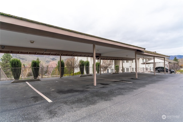 view of vehicle parking featuring a carport