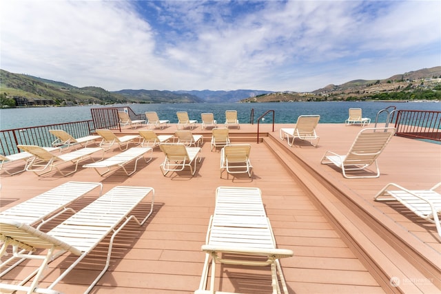 deck featuring a water and mountain view