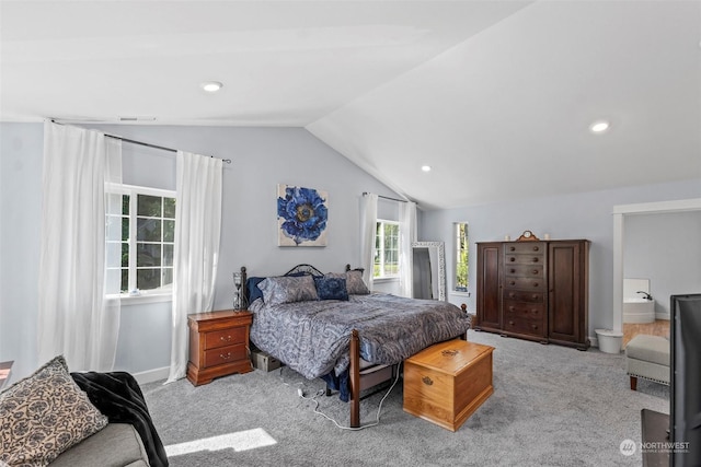 carpeted bedroom with vaulted ceiling