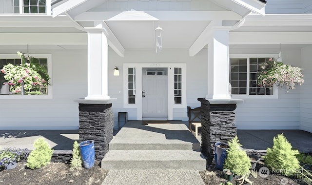 doorway to property with a porch